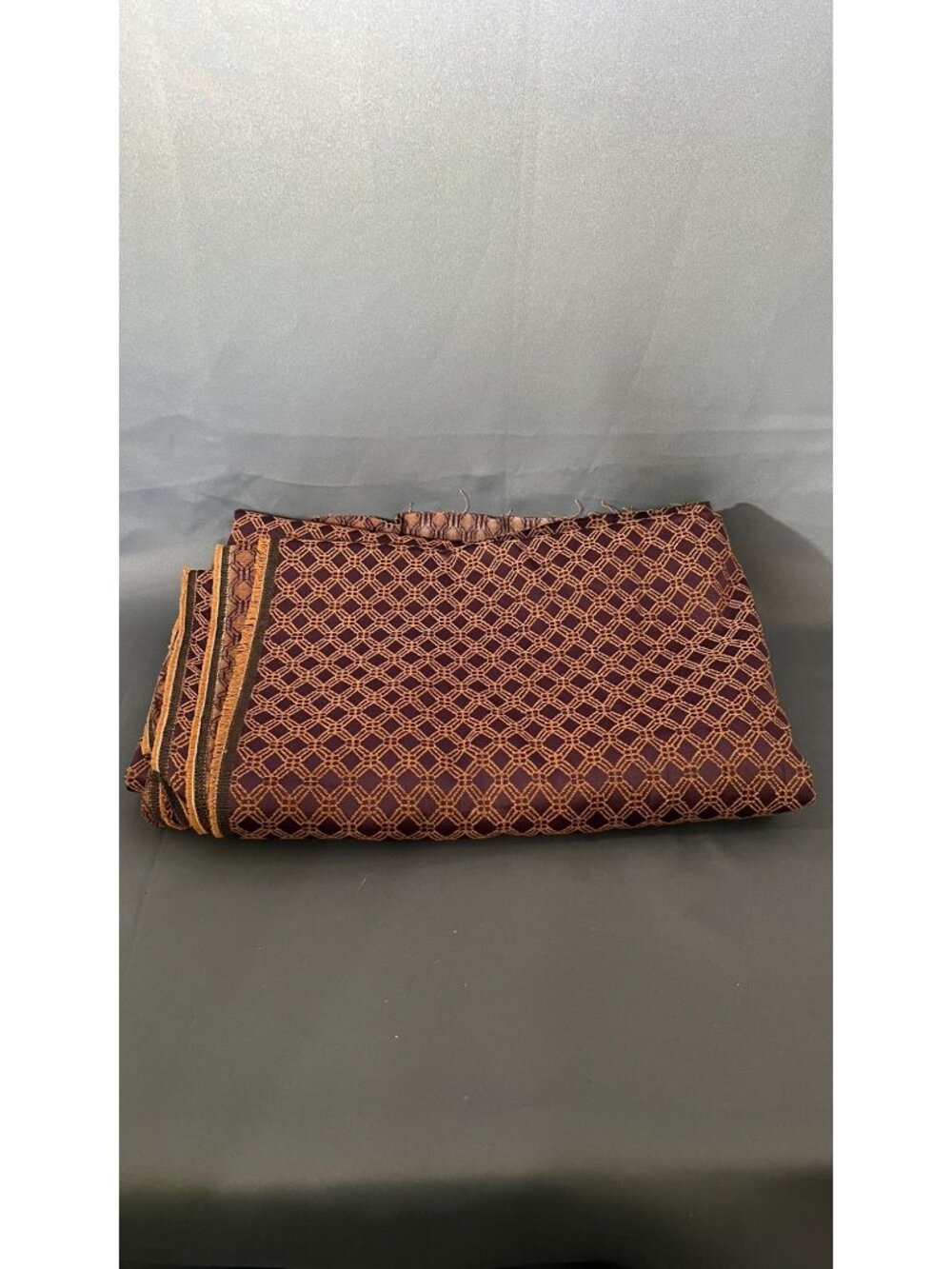 Luxury Burgundy Woven Fabric With Gold Geometric Pattern